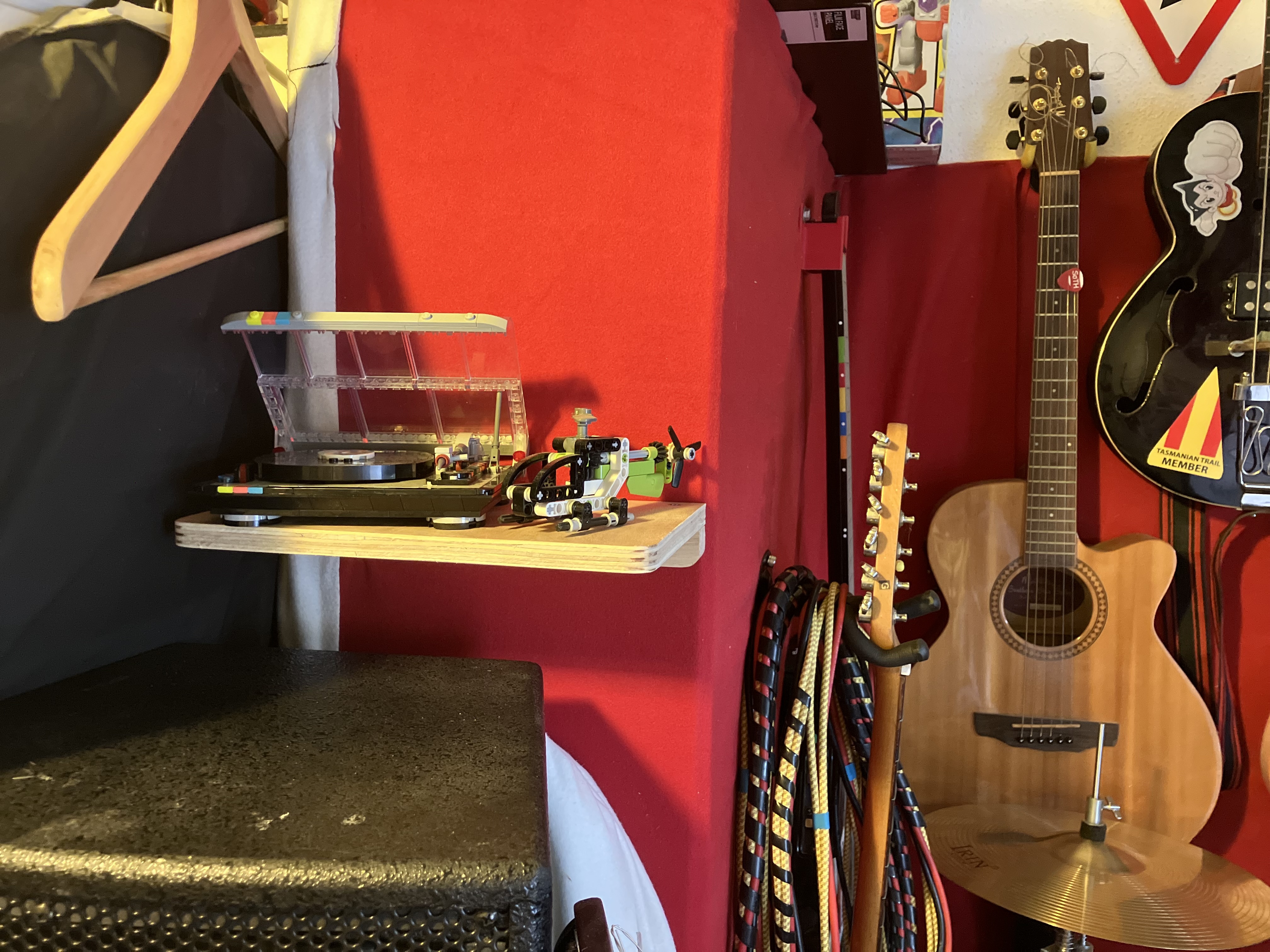 lego turntable sitting on the completed shelf along with the lego technic mini helicopter